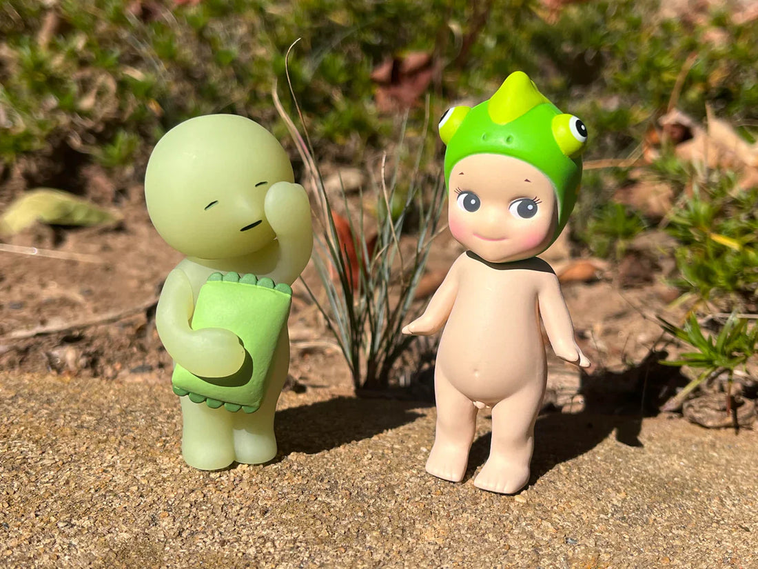 Sonny Angel and Smiski in the grass 