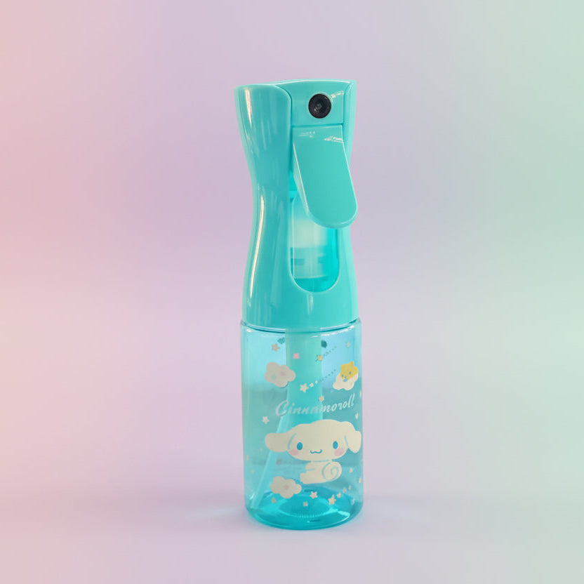 Blue spray bottle with cartoon design on a white surface with cardboard boxes in the background