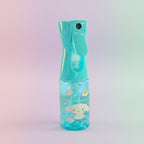 Blue spray bottle with cartoon design on a white surface with cardboard boxes in the background