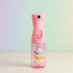 Pink spray bottle with cartoon character on a white surface with colorful bottles in the background.