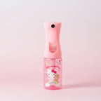 Pink handheld sprayer with hello kitty on a gradient pink background