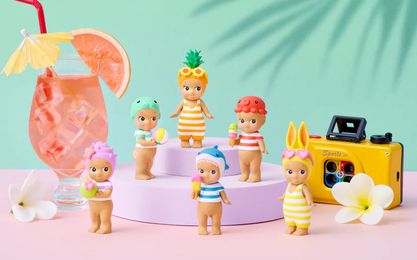 Sonny Angel kawaii blind box figures in striped summer swimwear – Sun-Kissed Style pineapple shark and unicorn designs