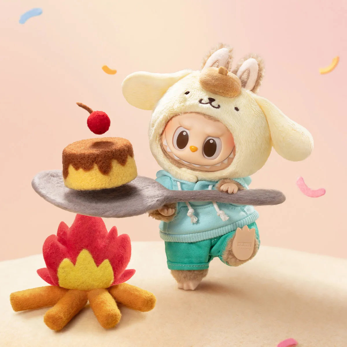 Plush toy character holding a cake over a campfire on a pink background