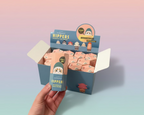 Hand holding a 'Hippers' product with packaging in the background