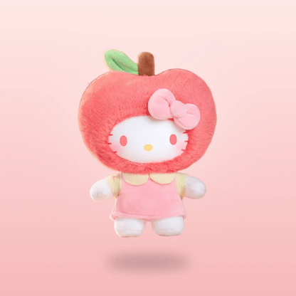 A Hello Kitty plush toy shaped like an apple, featuring a pink fuzzy apple body with a green leaf, a pink bow, and Hello Kitty's face peeking out from inside, set against a soft pink gradient background.