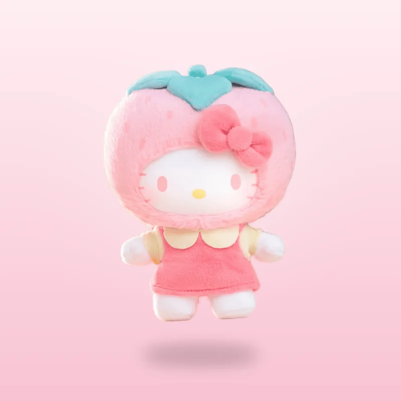 A Hello Kitty strawberry plush toy floating against a soft pink gradient background. The character is styled as a strawberry with a pink fuzzy body, a light blue-green leafy crown, a pink bow, and a pink dress.